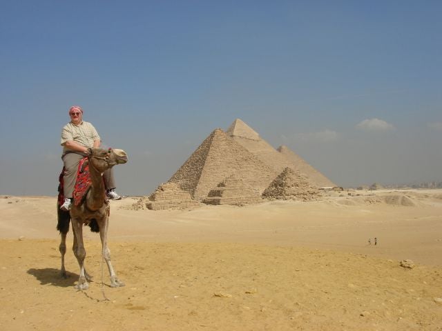 Photo of Peter Churcher on a camel in Egypt