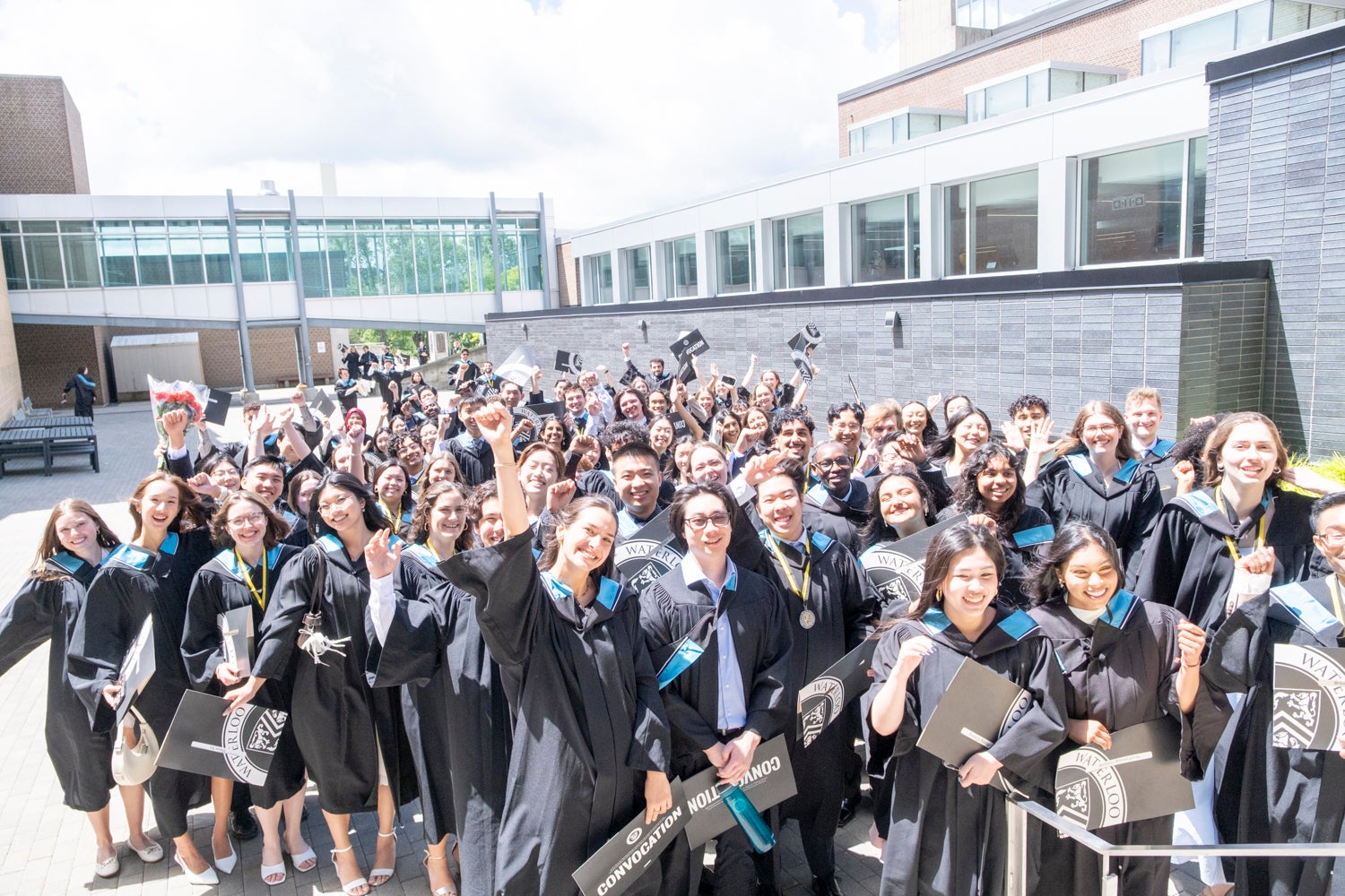 Science graduates grouped together outside following the convocation ceremony