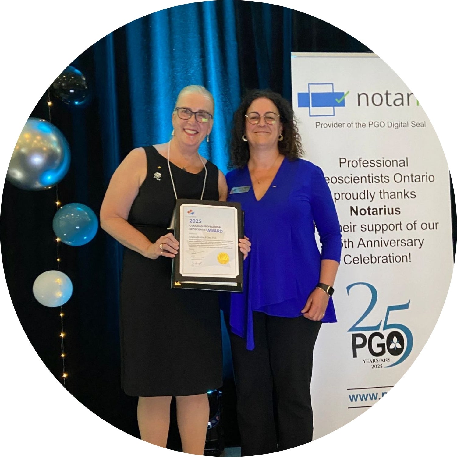 Andrea Waldie on stage with a certificate