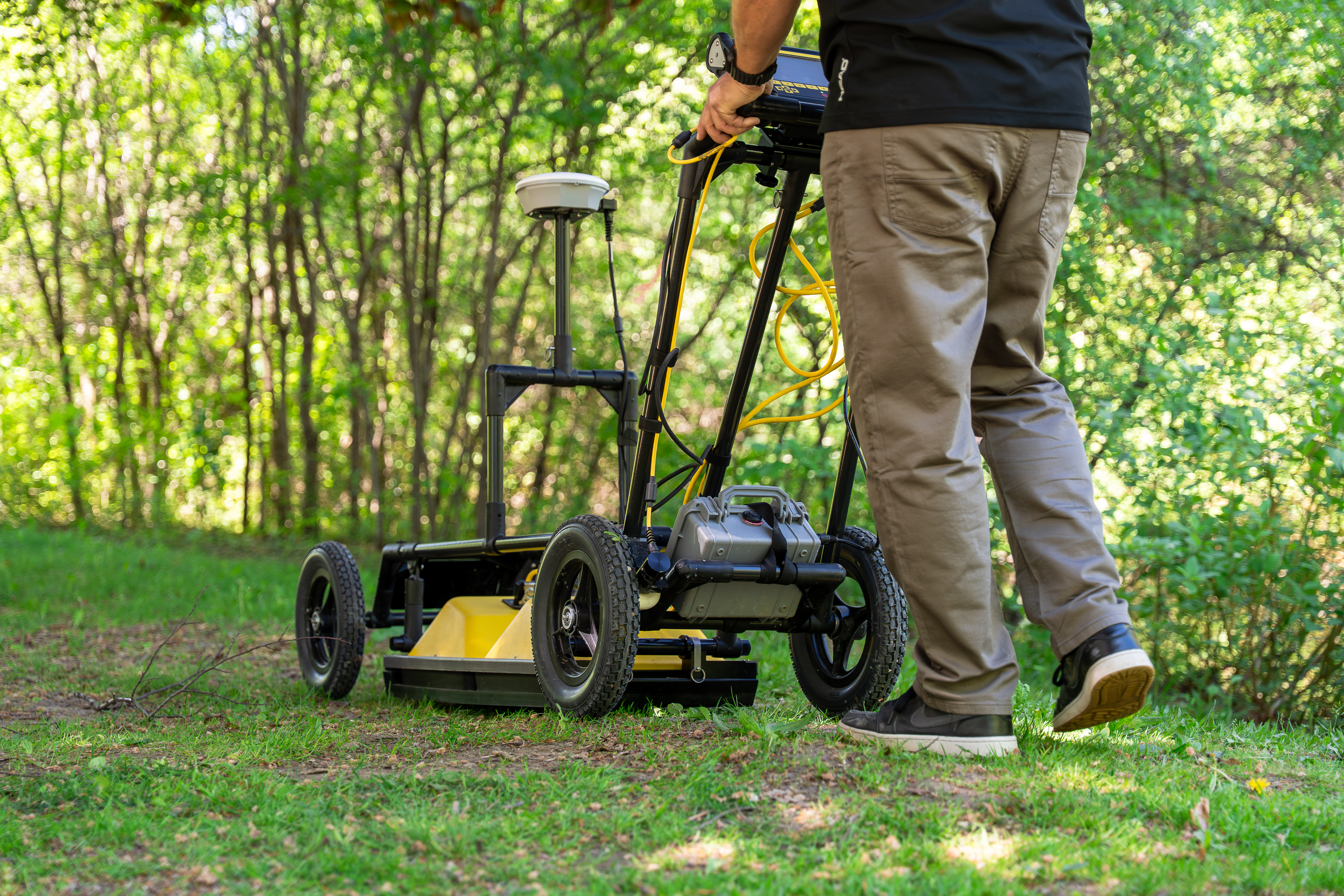 Dr. Colby Steelman with ground-penetrating radar equipment.  