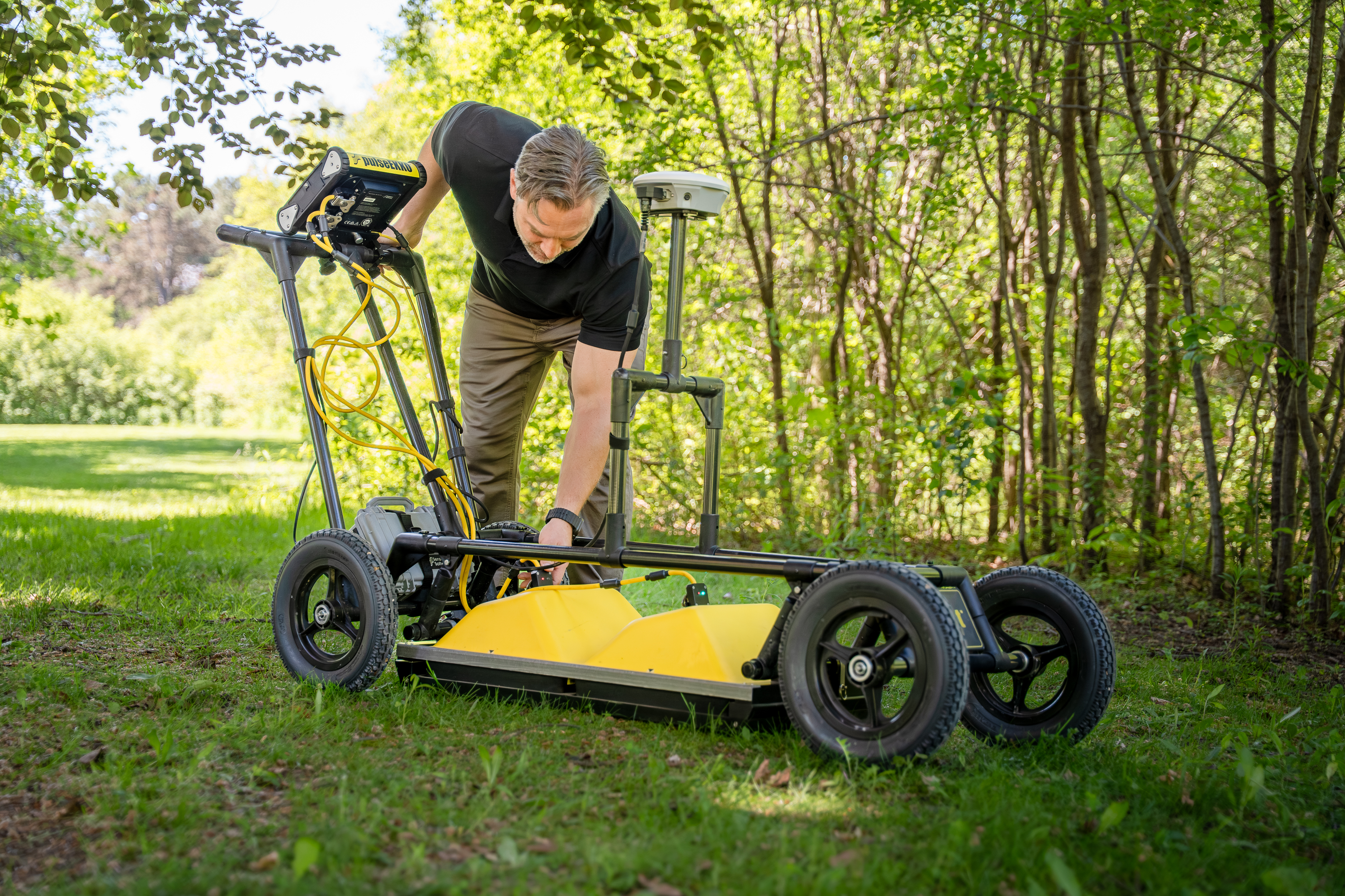 Dr. Colby Steelman with ground-penetrating radar equipment.  
