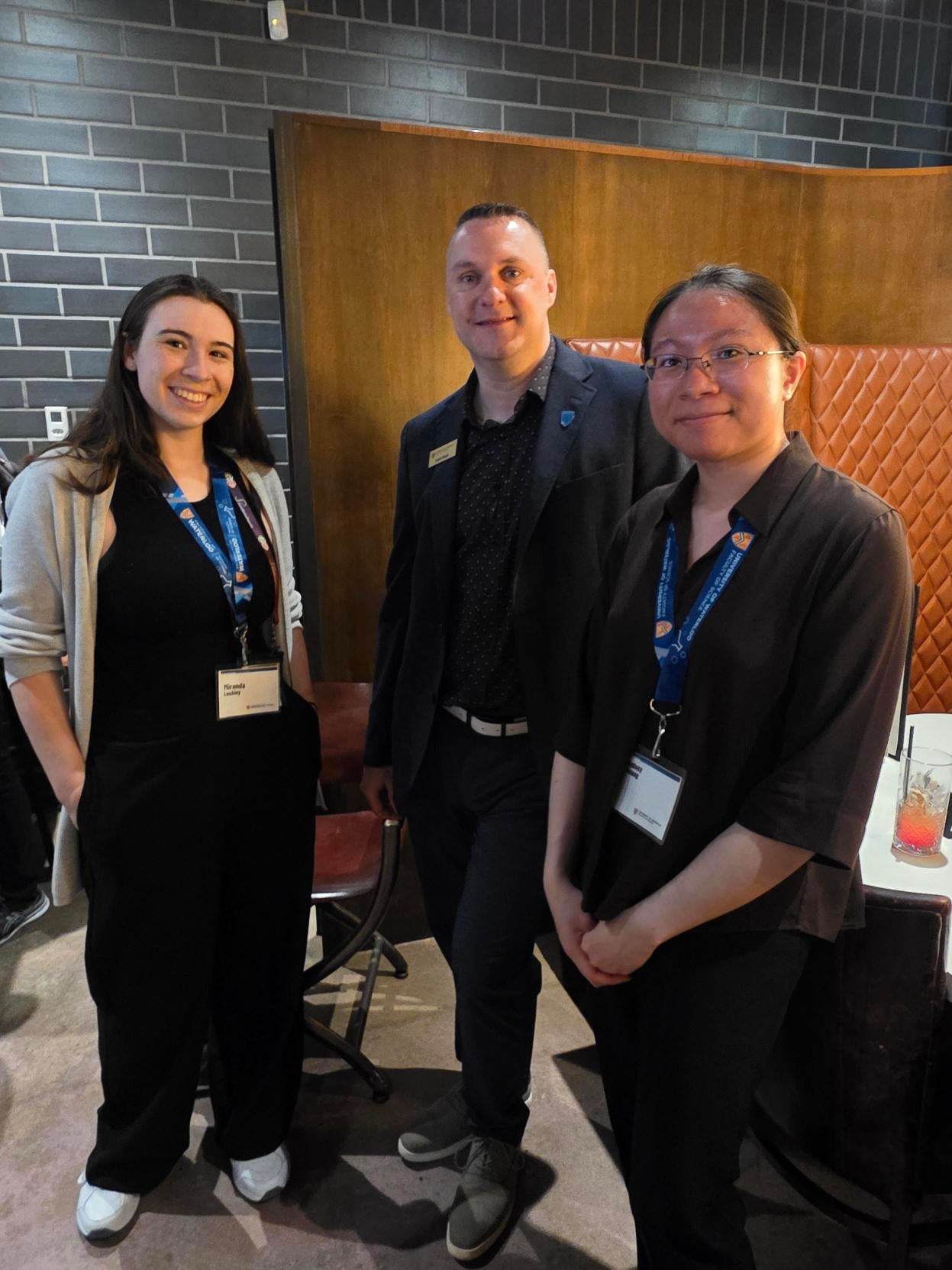 Two event attendees with Graham Murphy, a Waterloo chemistry prof