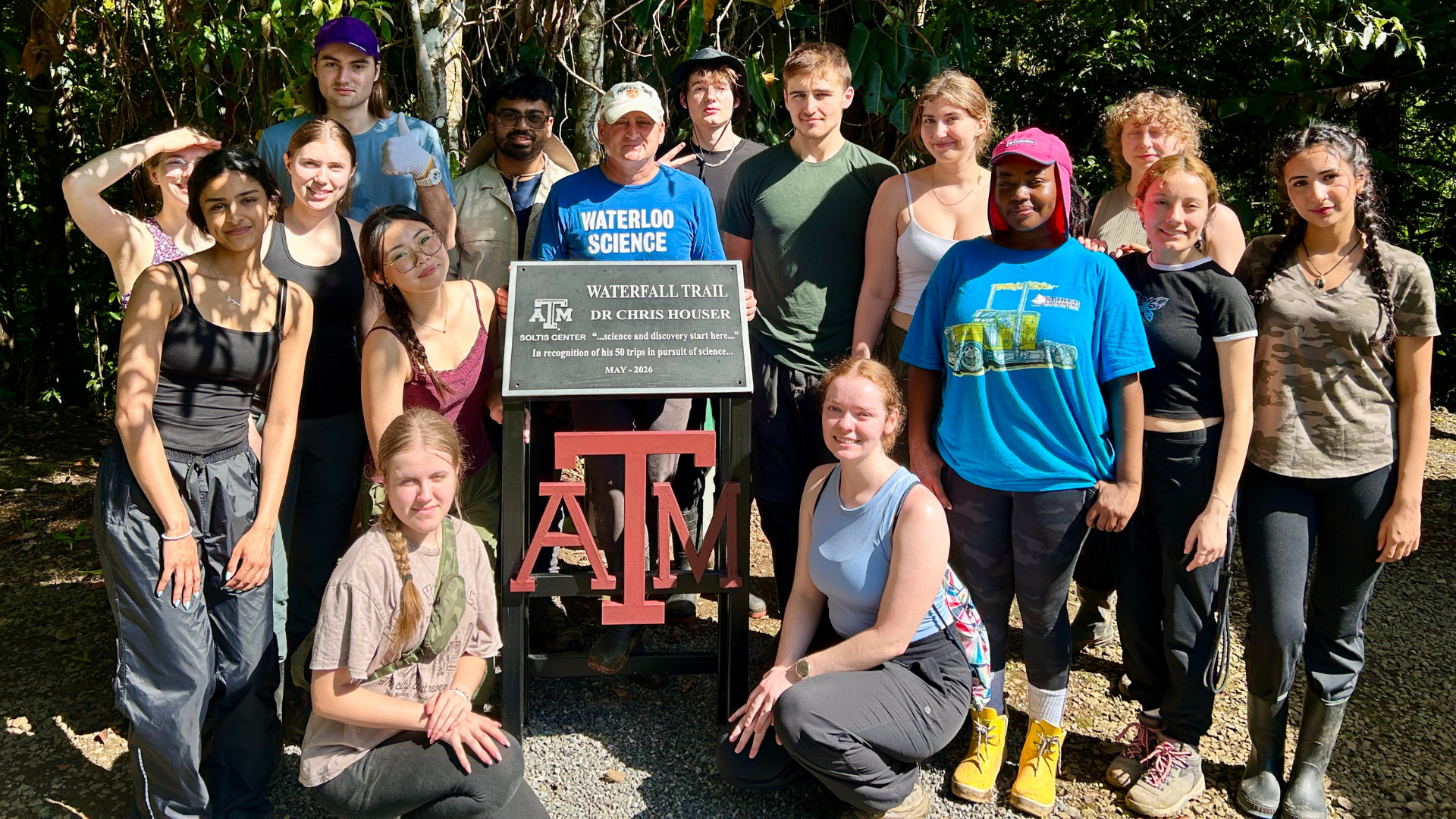 Dean Chris Houser in Costa Rica with students at the Houser waterfall trail.