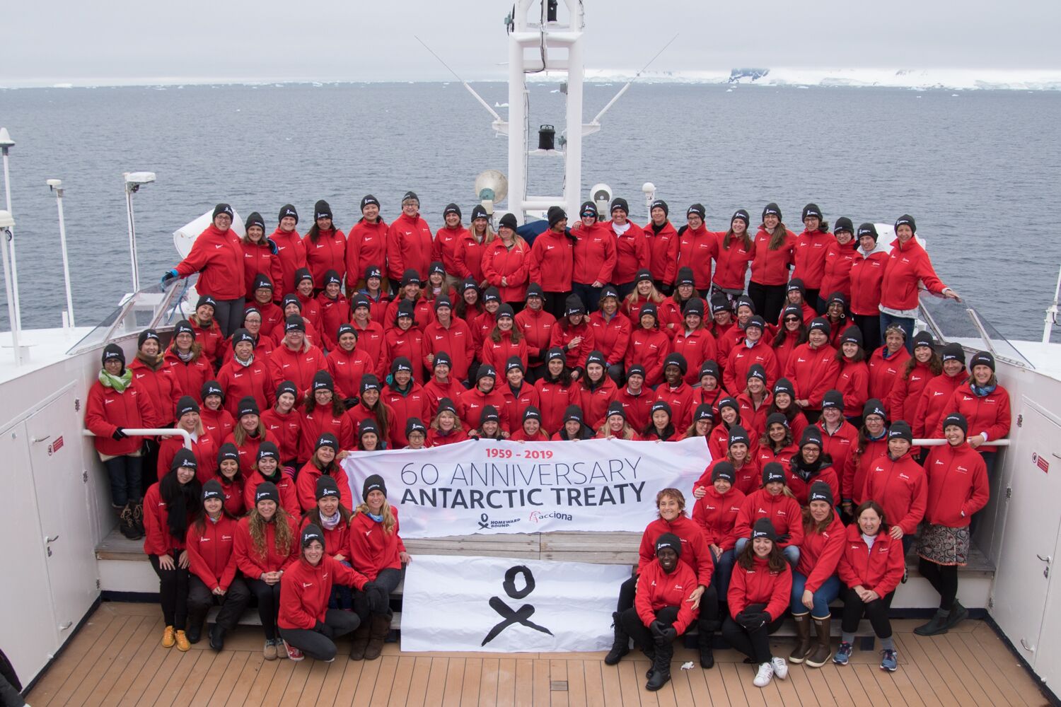 Homeward Bound 4 cohort with Antarctic treaty flag