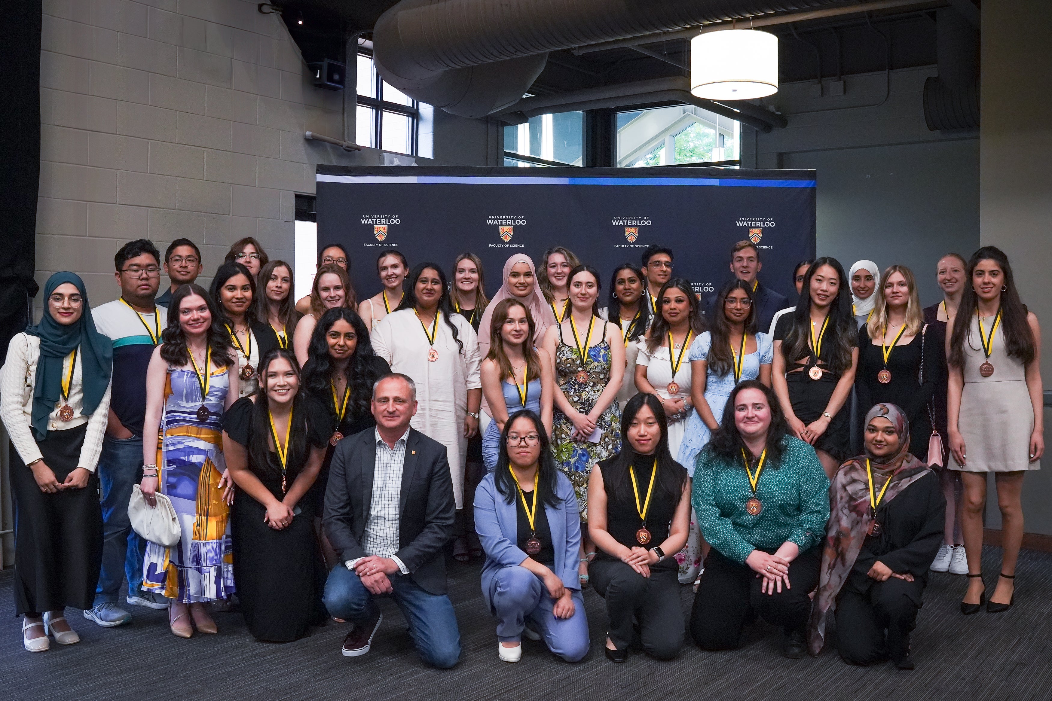Group of award winners posing for a picture with the Dean of Science.