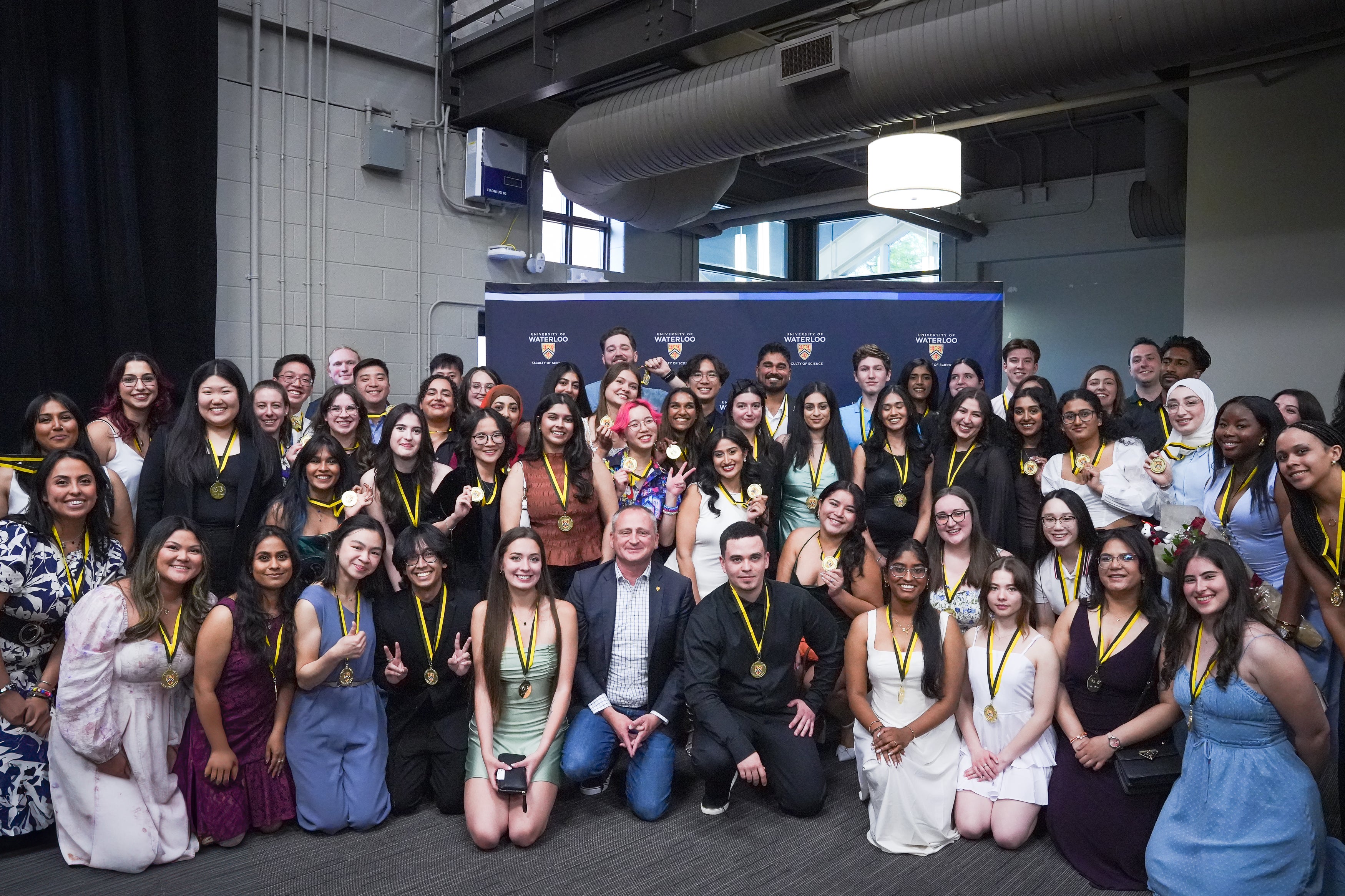 Group of award winners posing for a picture with the Dean of Science.