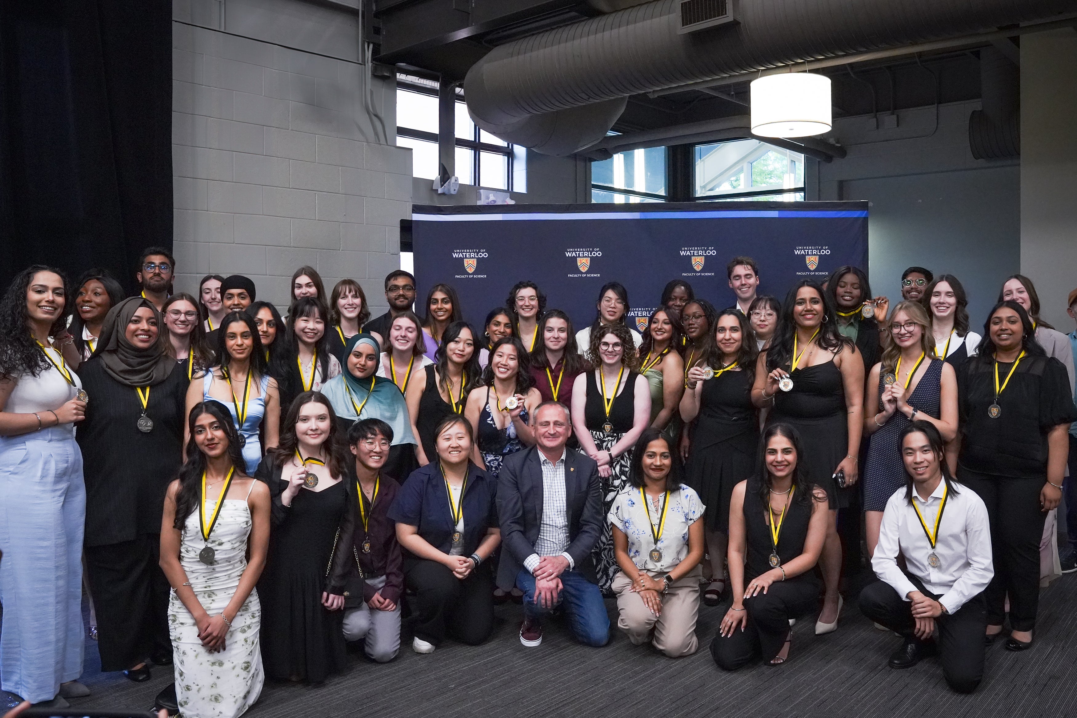 Group of award winners posing for a picture with the Dean of Science.