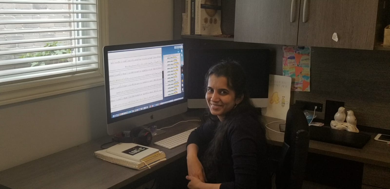 Subha Kalyaanamoorthy at her computer in her home office.