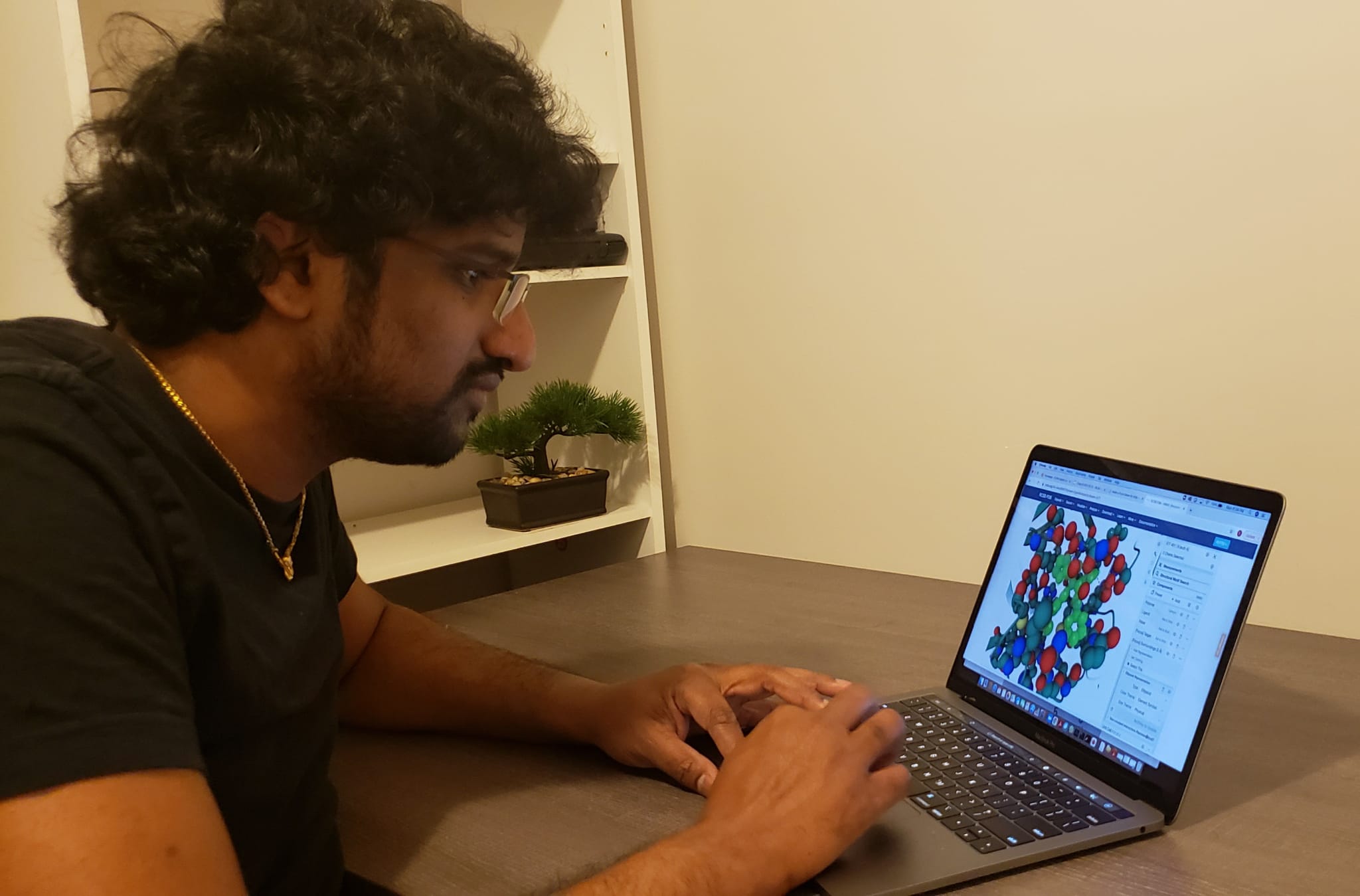 Aravindhan Ganesan working at a computer.