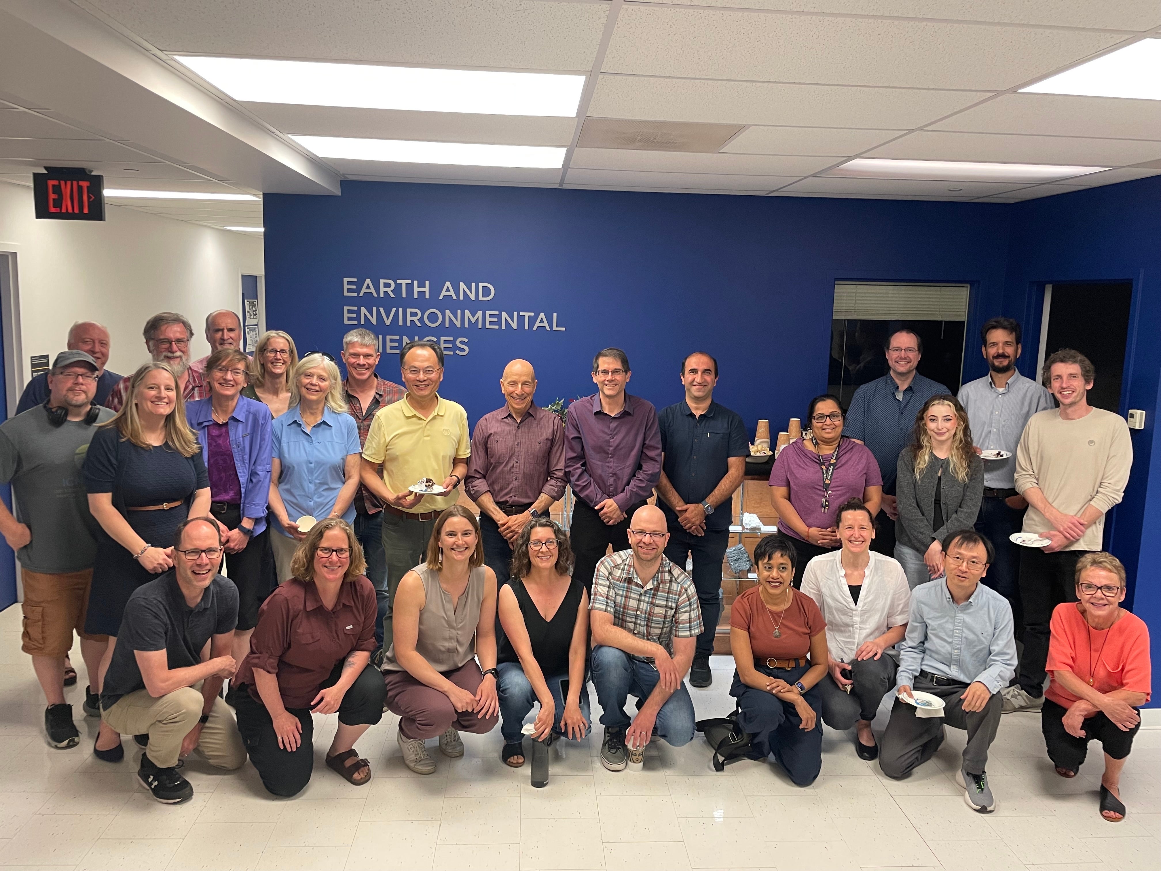 The Earth and Environmental Sciences team pose for a group shot at Mario Coniglio's retirement party.