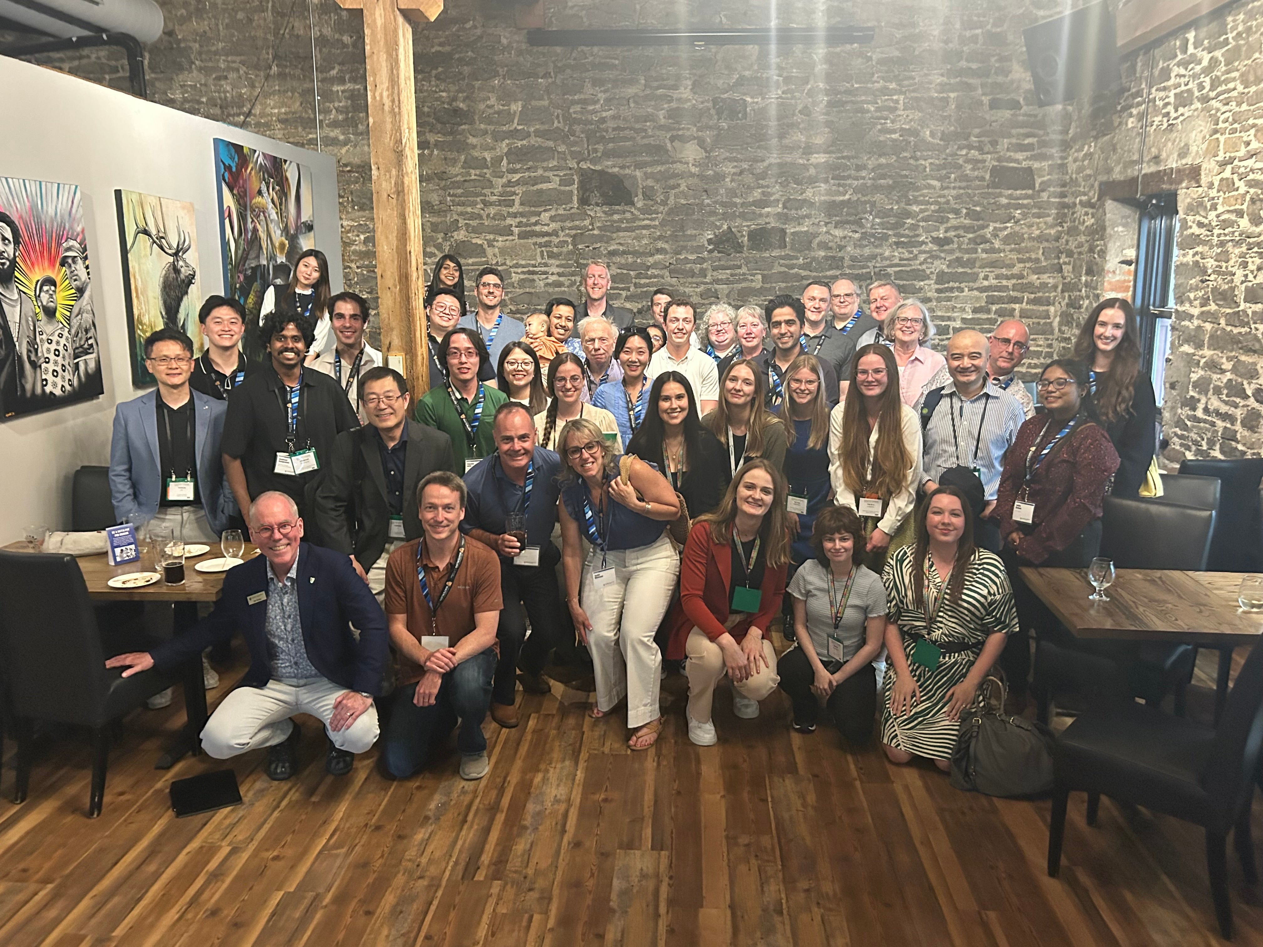 A group of 40 people at an alumni social