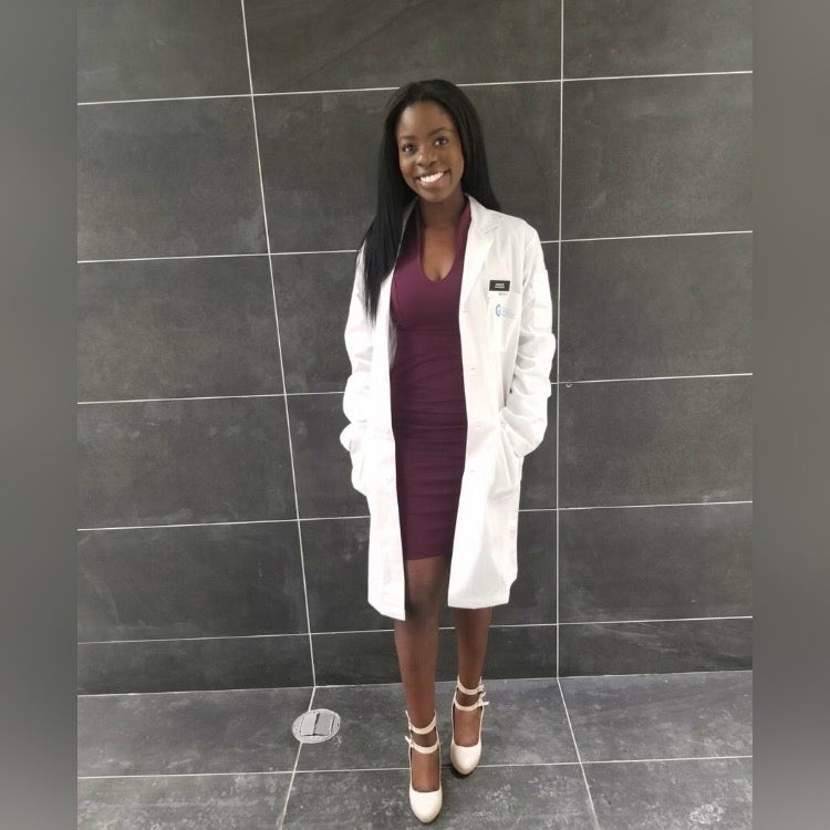 Jocelyn Bonti-Ankomah in a white lab coat.