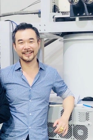 Joe Han leaning on quantum computing hardware