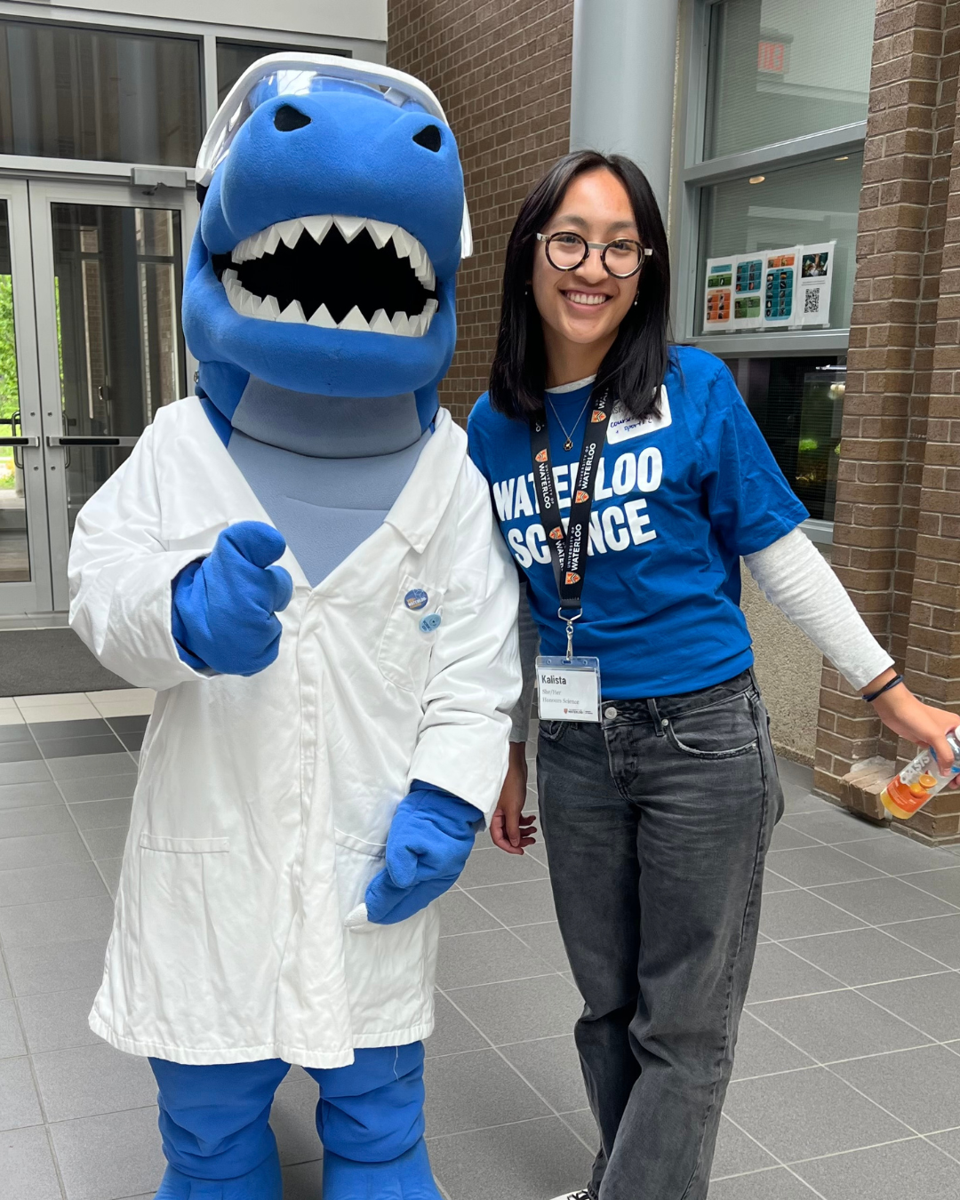 Kalista at an open house event with the science mascot, Cobalt.