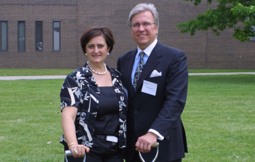Dr. Marta Witer and Ian Ihnatowycz standing with shovels.