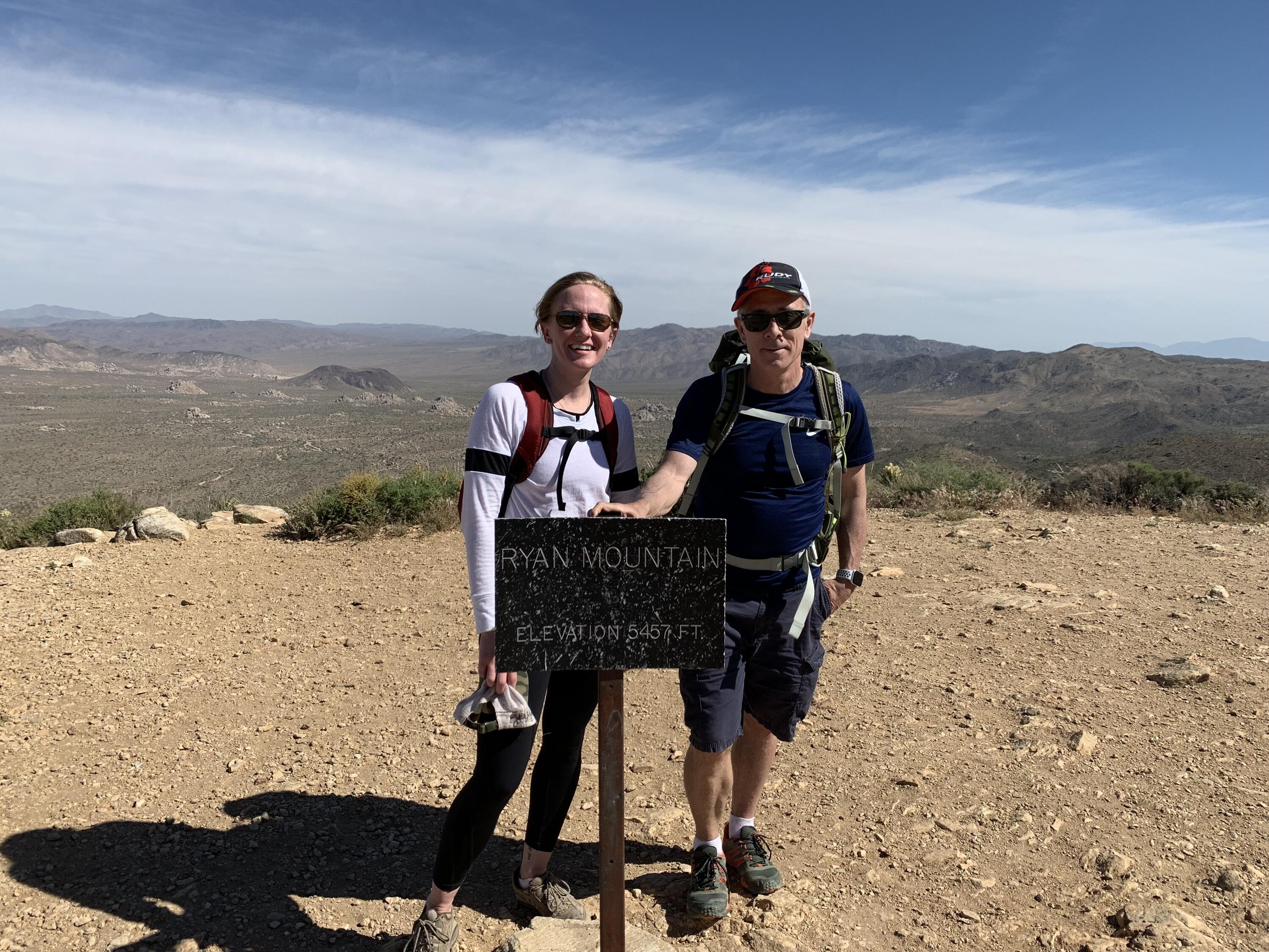 Michael Houston and Meaghan Middleton at the summit of a mountain