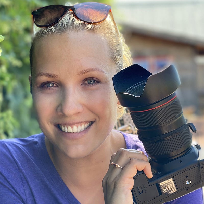 Olga Shmaidenko holding a camera