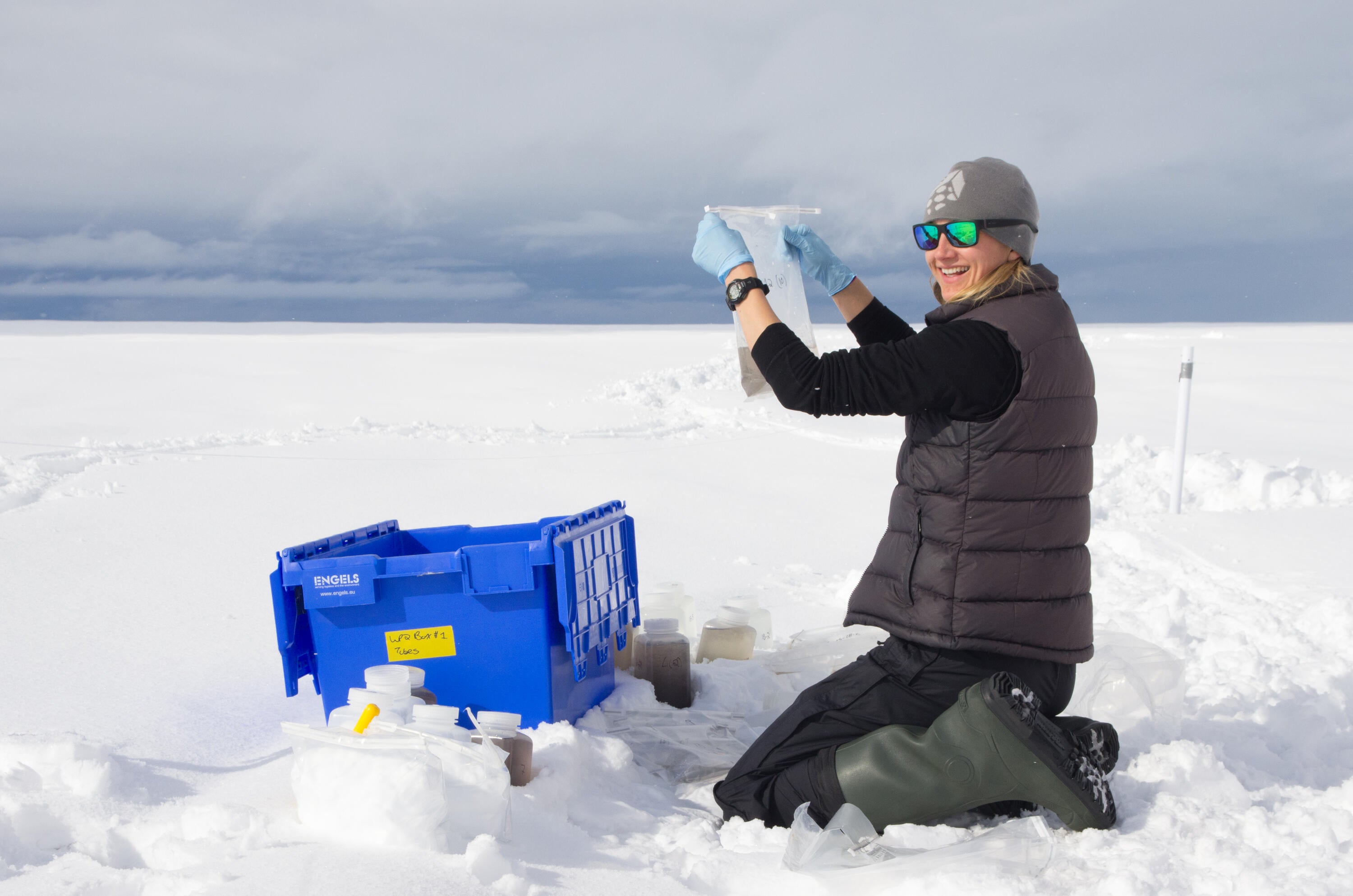 Jenine McCutcheon sampling snow and ice on the Greenland Ice sheet