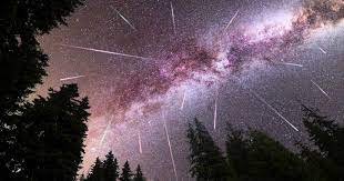 pink night sky with perseid shower