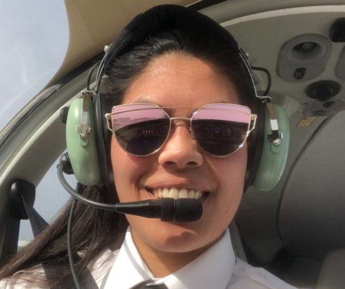 Portrait of Manouchka Bucktowar in plane with headset on.