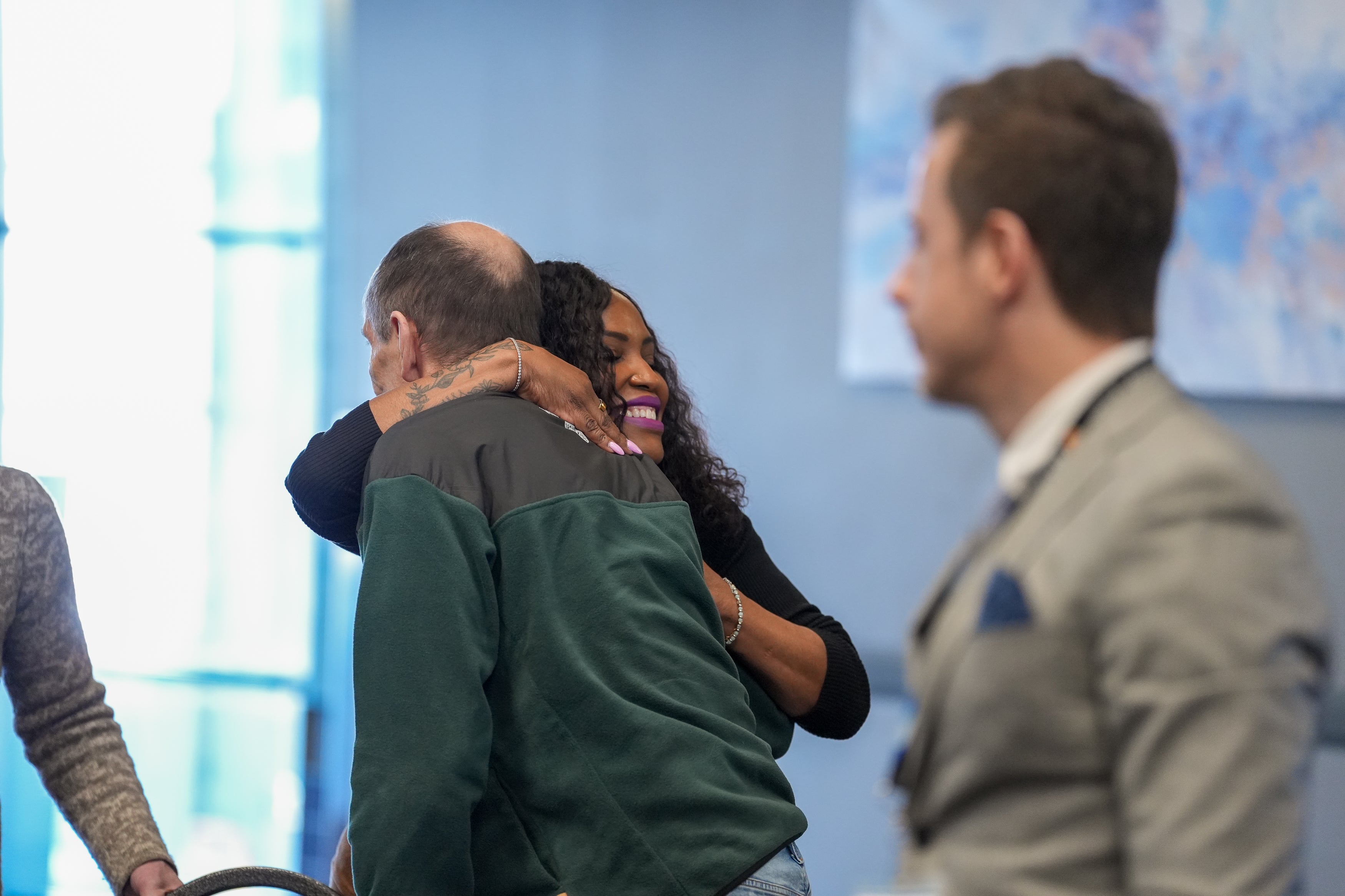 Yvonne Stevens hugging one of her guests