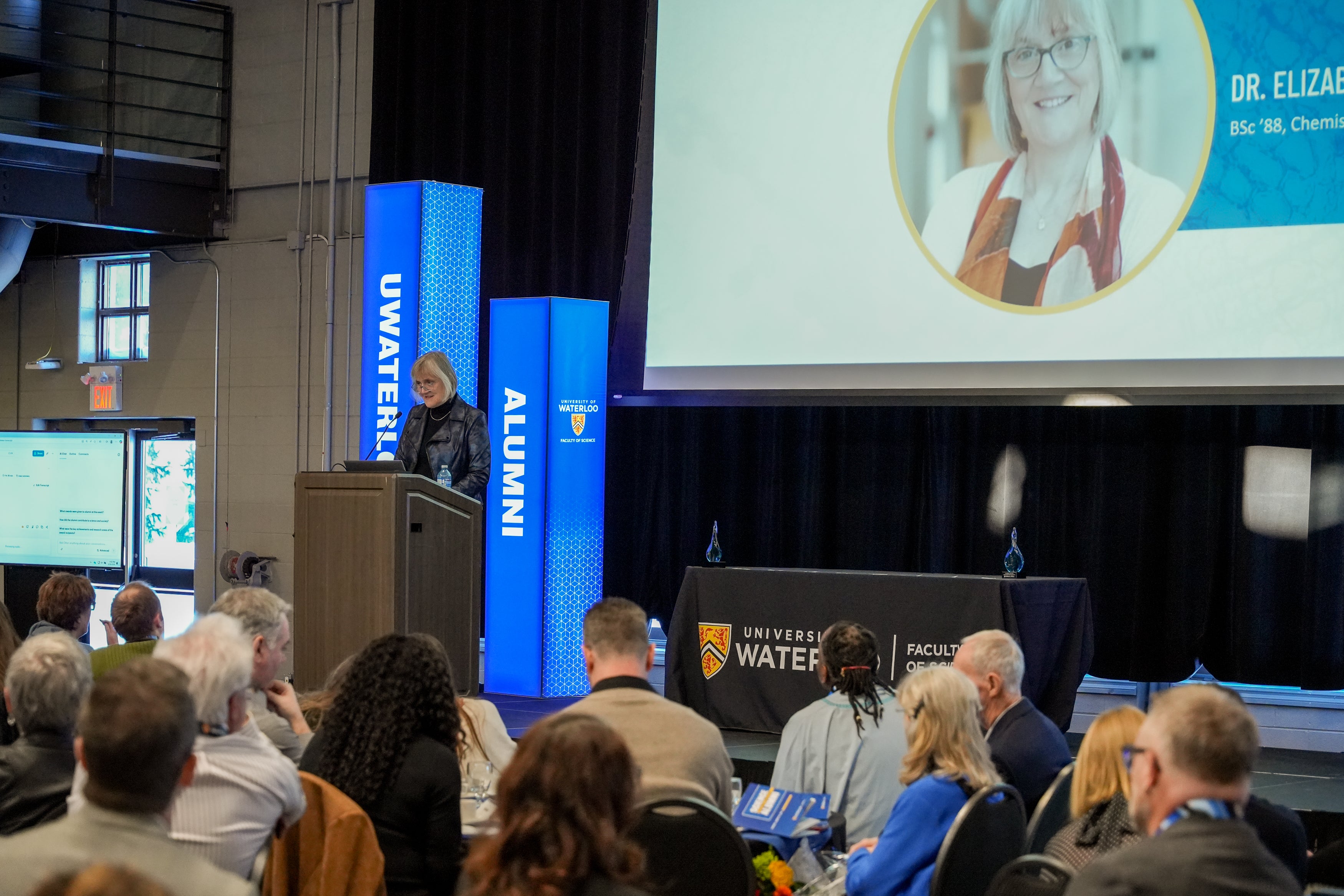 Dr. Elizabeth Meiering accepting her award on stage