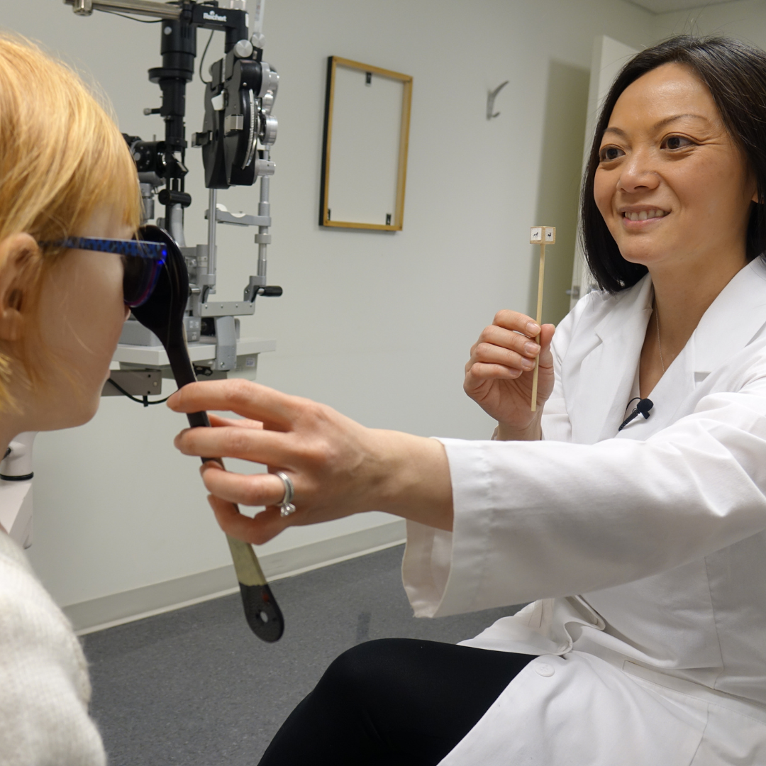 An optometrist performing an eye exam.