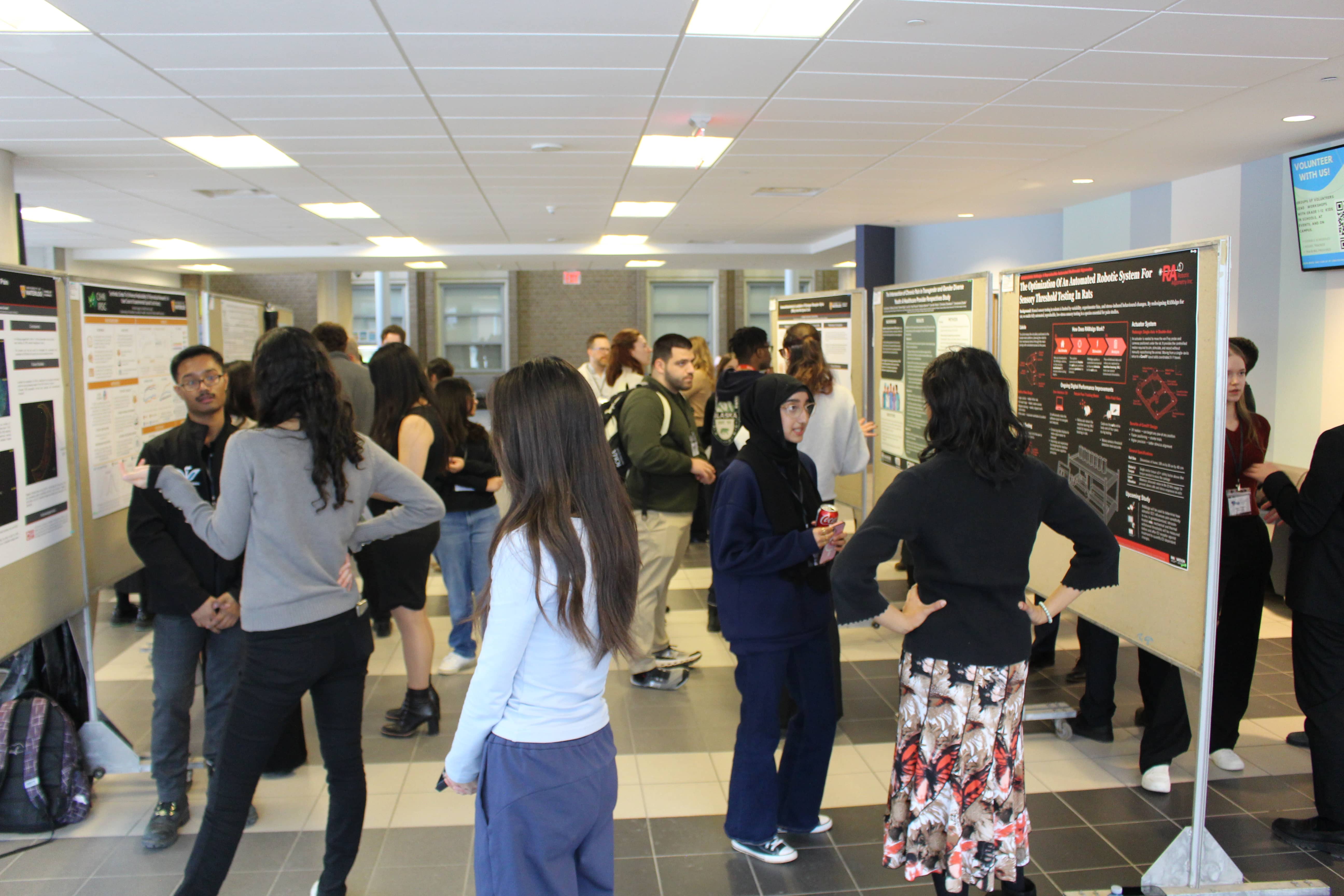 SoNR conference 2025 poster session jam packed with participants and attendees.