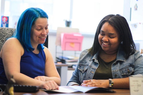 Student working with an advisor.