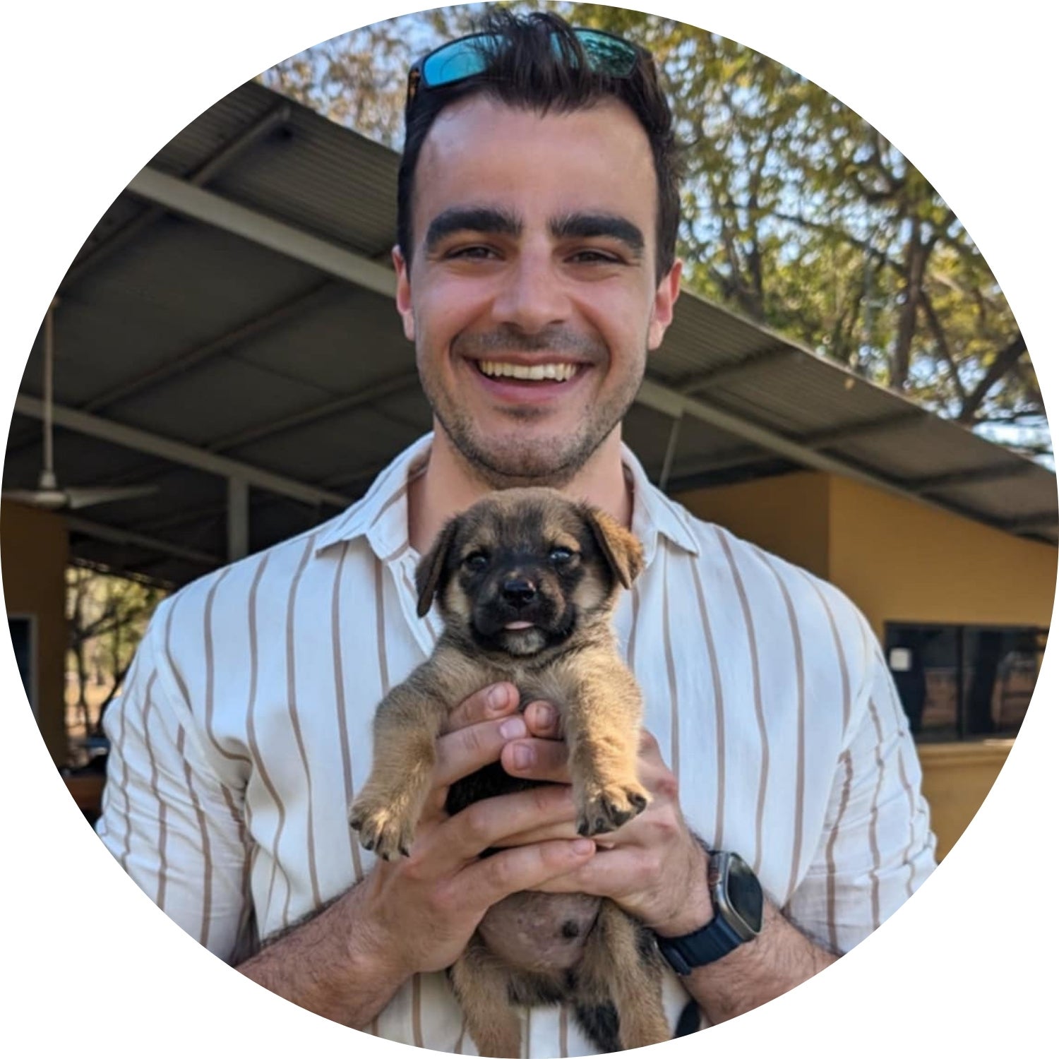 Tyler Marques holding a very cute puppy