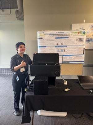 Miles Yoshida presenting their research.