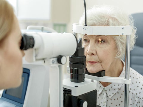 Old lady getting her eyes checked