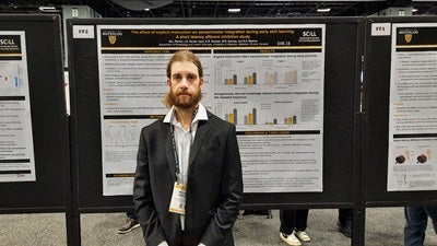 Michael Perrier presents their research at the 2023 Society for Neuroscience Annual Meeting