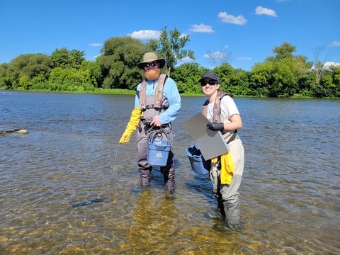 Sarah and Patrick sampling water