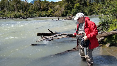 Professor Servos taking water quality measurement in Patagonia
