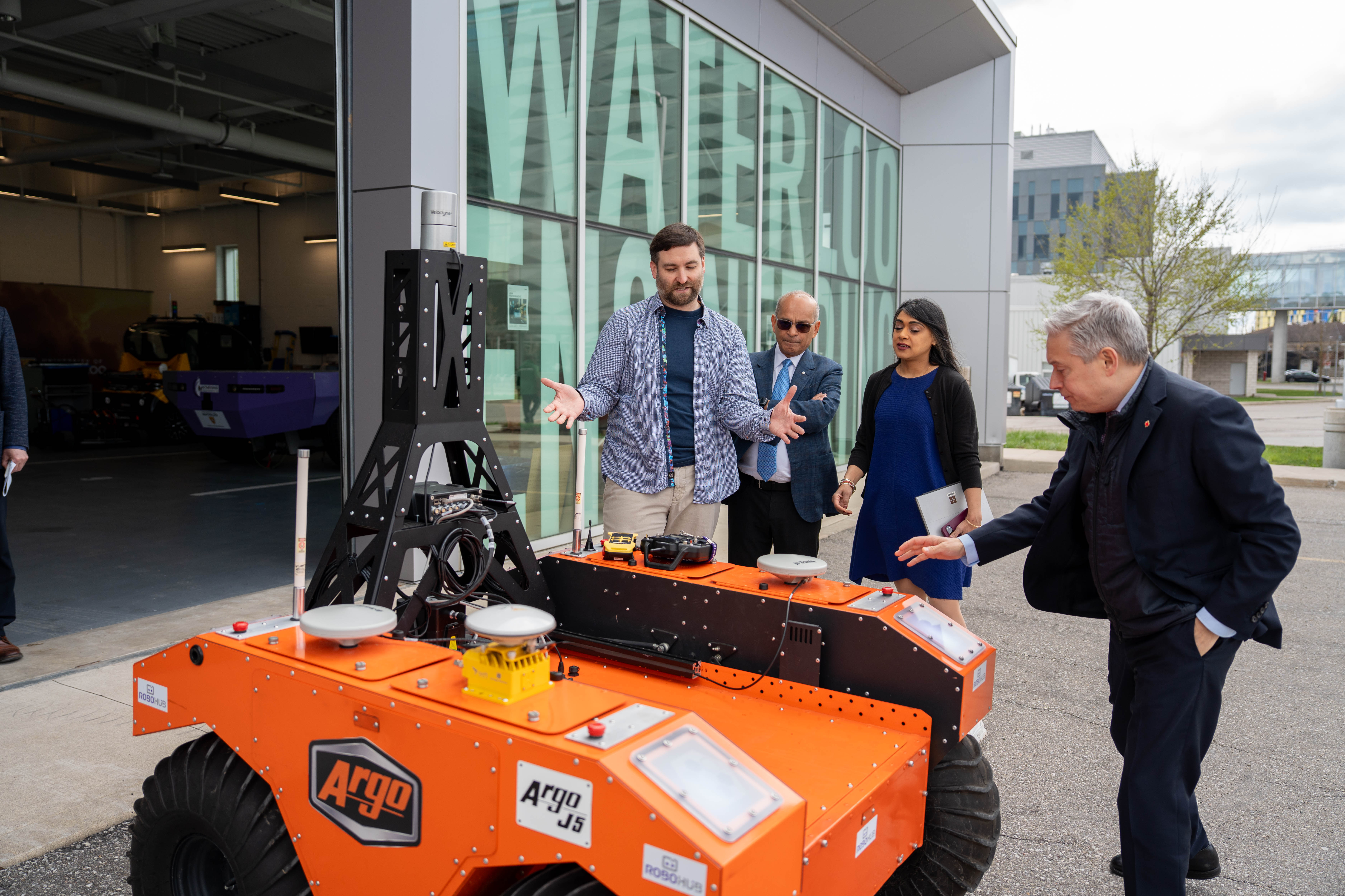 Vivek Goel and politicians taking note of a drone vehicle