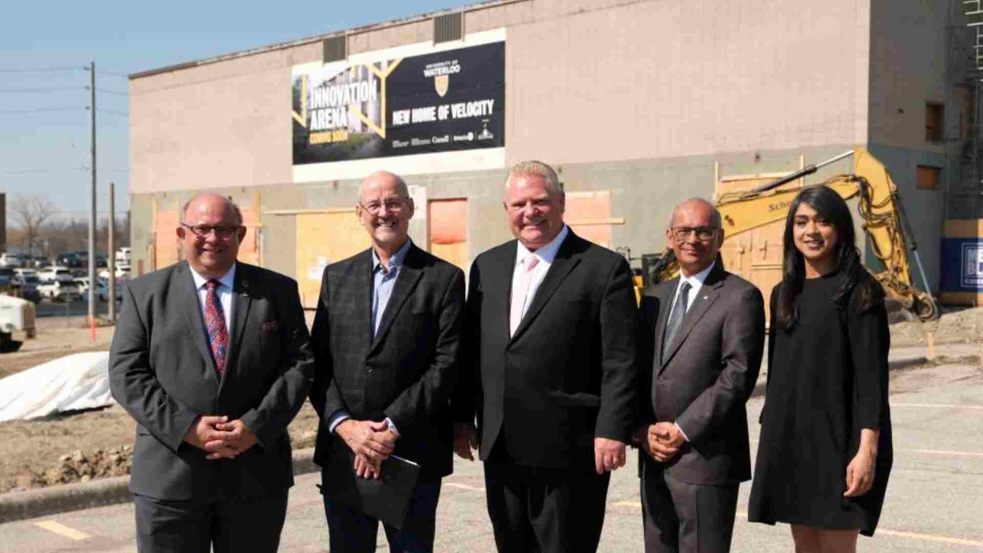 Vivek and some local politicians standing in front of the Innovation Arena