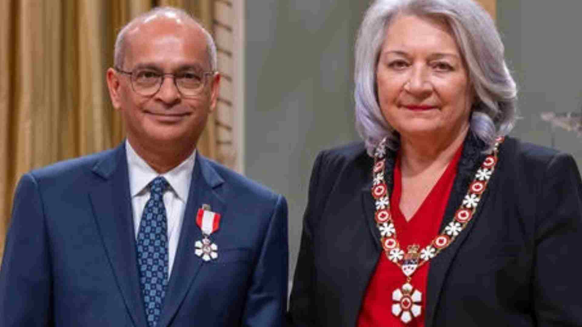 Vivek and another woman wearing order of Canada medals 