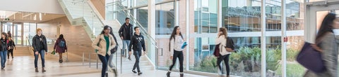Students walking in the Health Expansion Building