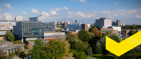 Aerial view of campus with yellow checkmark