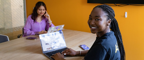 Two female Waterloo students in a study room with their laptops