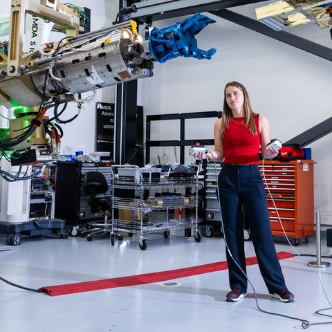 Mary McPhee testing part of the Canadarm2 robotic arm