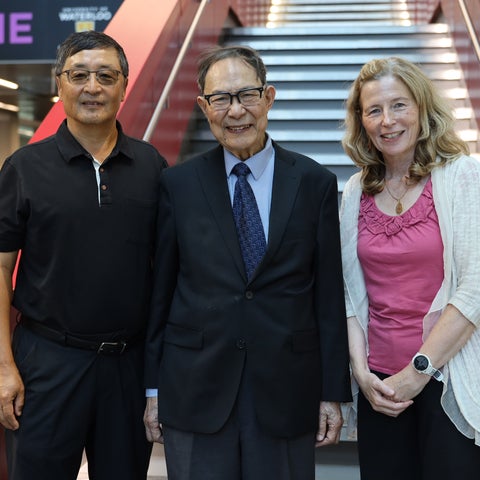 Albert Feng, Dr. Andrew Wong and Dean Mary Wells standing on the stairs of the Pearl Sullivan Engineering building