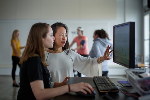 Students looking at a monitor