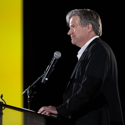 Dr. Bill Rosehart speaking at a podium