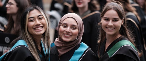 Three students at convocation