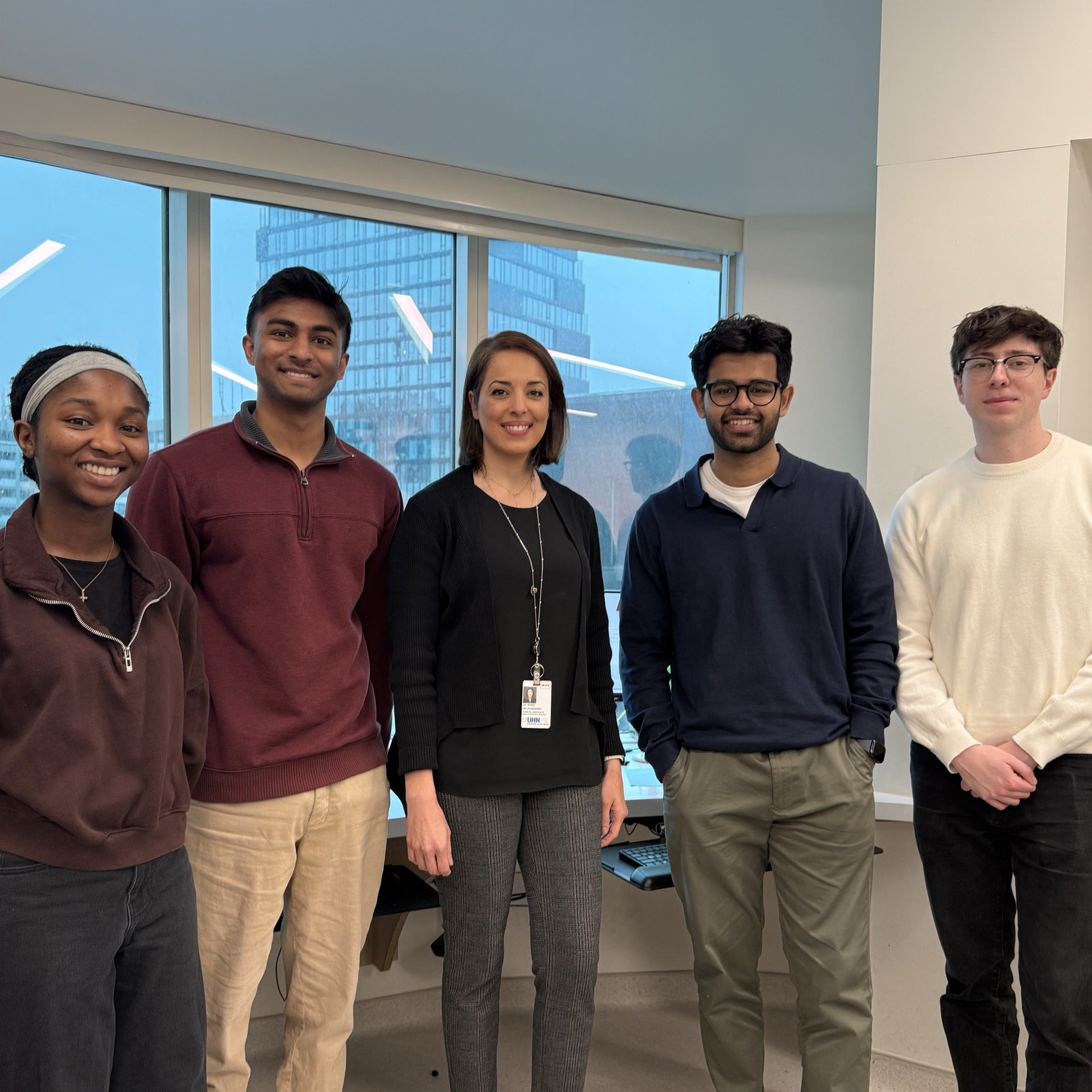 Waterloo students and staff from the Waterloo Region Health Network inside a health office