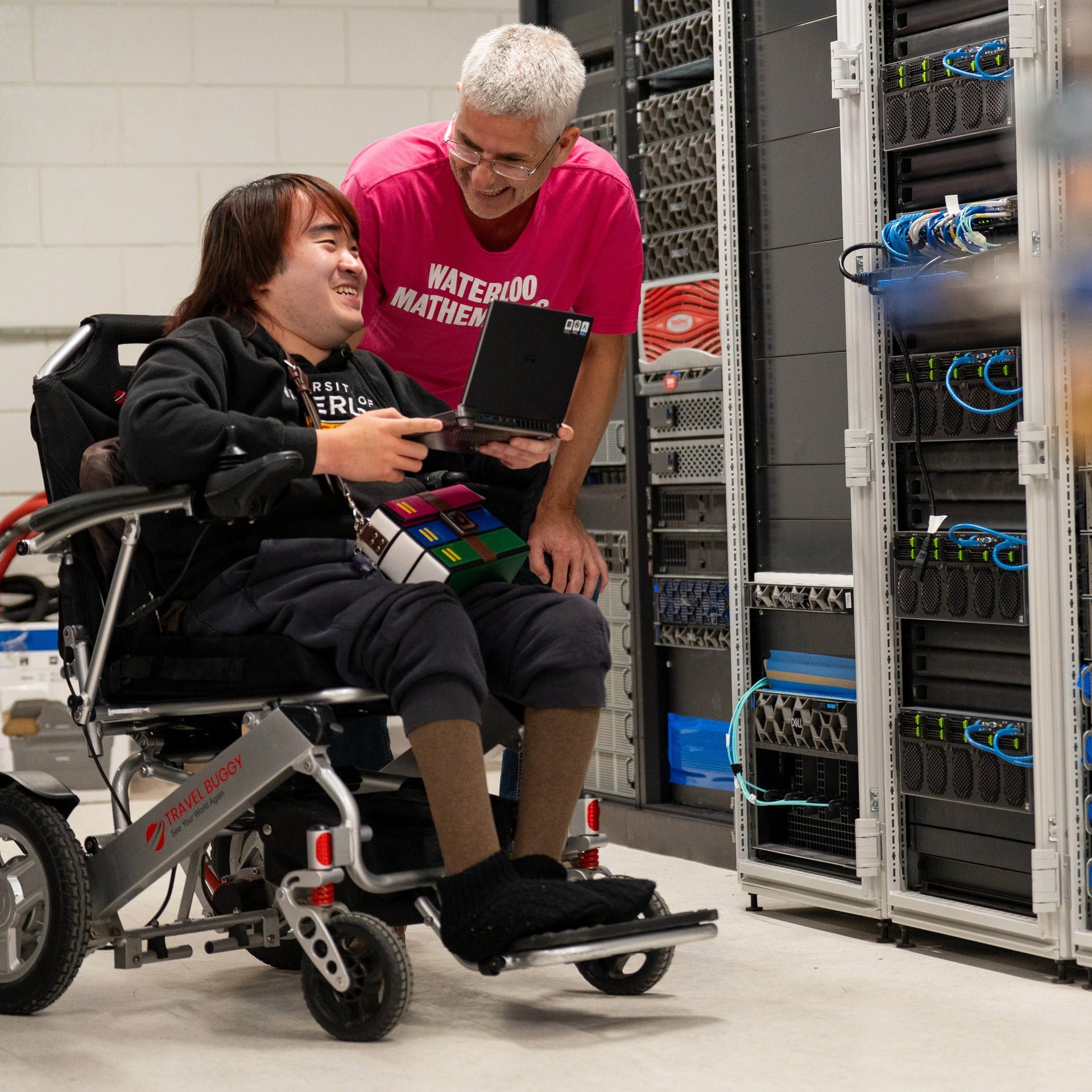 Dr. Martin Karsten and Peter Chai looking at server racks