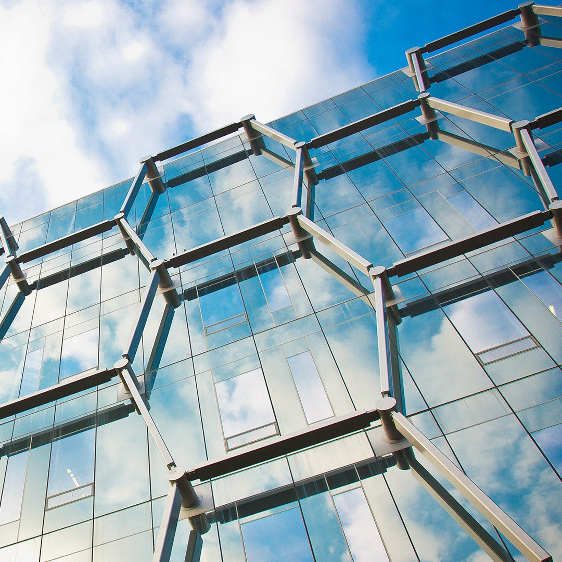 Exterior worms eye view of the Quantum-Nano Centre building with hexagon glass windows