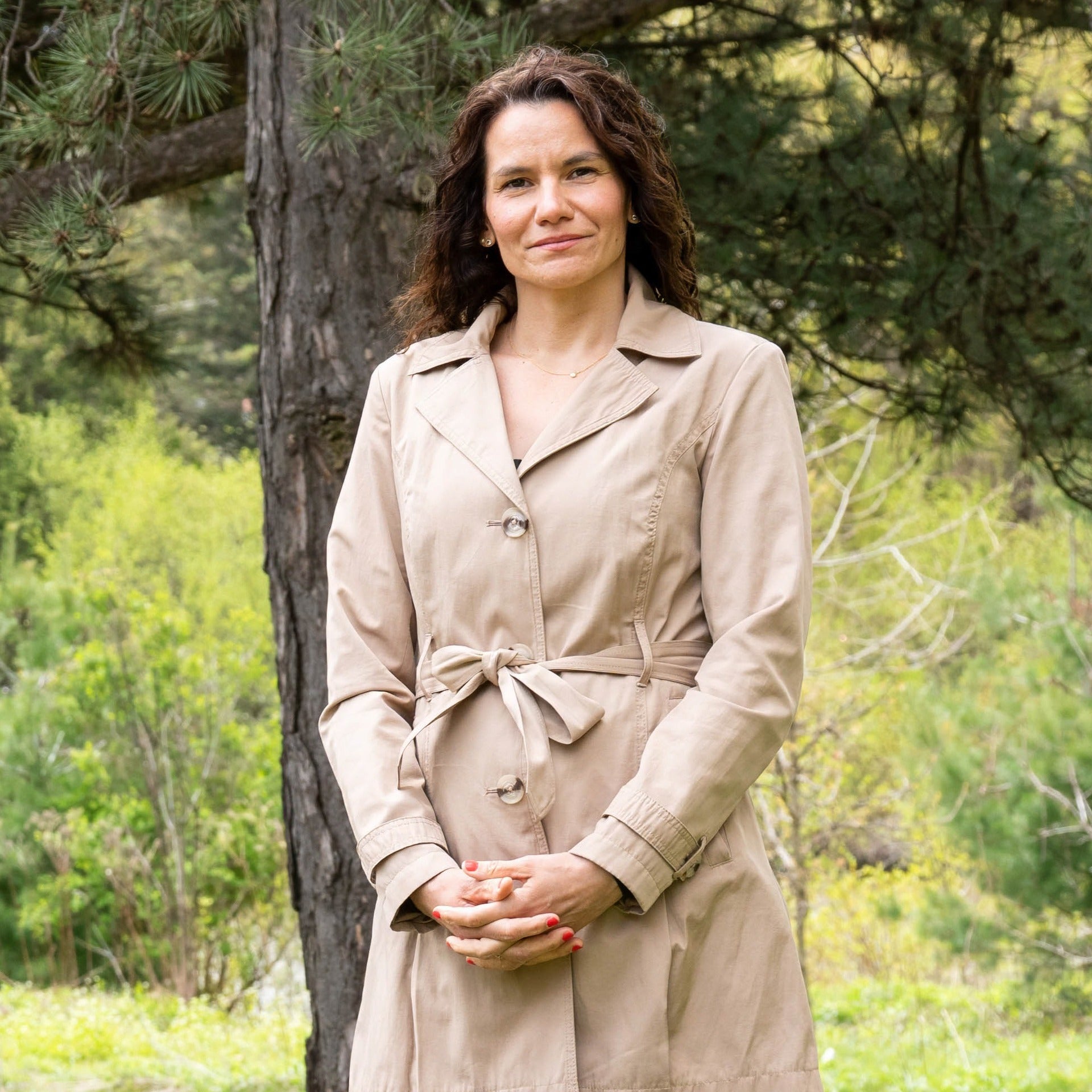 Anabela Bonada standing in the middle of trees and shrubs